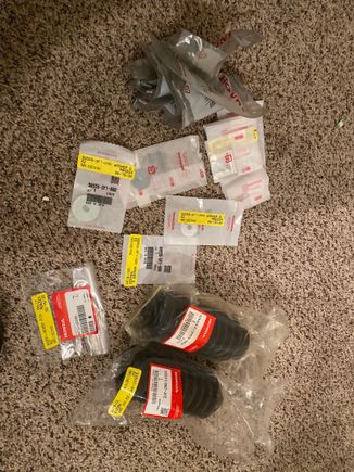 Some OEM thingss. I replaced the steering rack with an OEM (manual) one after 2-3 bad parts store racks. So you can see some new boots here for that, and misc other goodies. 
