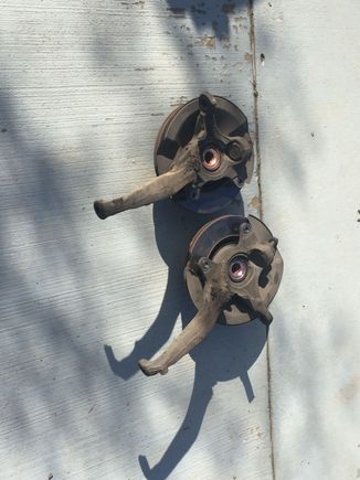 Got the good used knuckles from my parts car. I'll probably keep the old ones, put new hubs, rotors bearings, lug studs and lower ball joints on them so I have a set ready to throw on. At that time I'll probably want to do axles, inner/outer tie rods, bellows boot and upper ball joint.... All that would be so sweet and expensive.