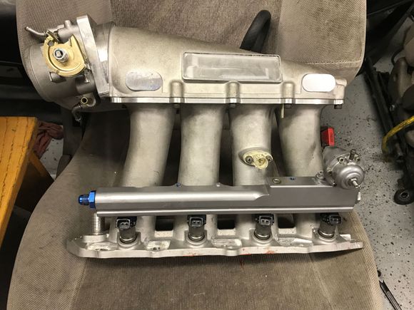 skunk2 street ultra, 70mm throttle body and aem fuel rail. simple engine set up but its going to be rev happy.
