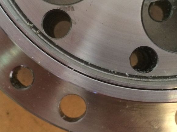 The bolt holes and the threads where machined out to allow the new bolts to go straight threw.