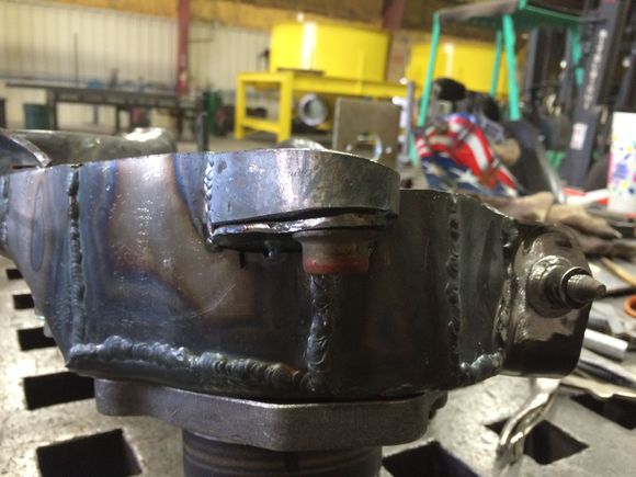 Tab built onto the trailing arm