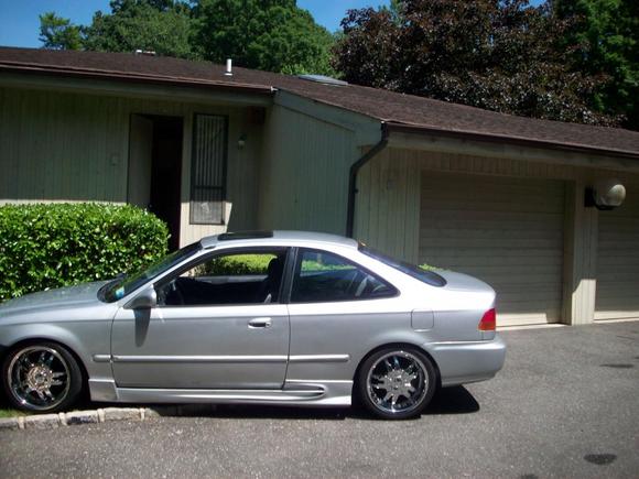 Starr 17" rims (chrome section) 2 inch drop with some side skirt from a body kit.
