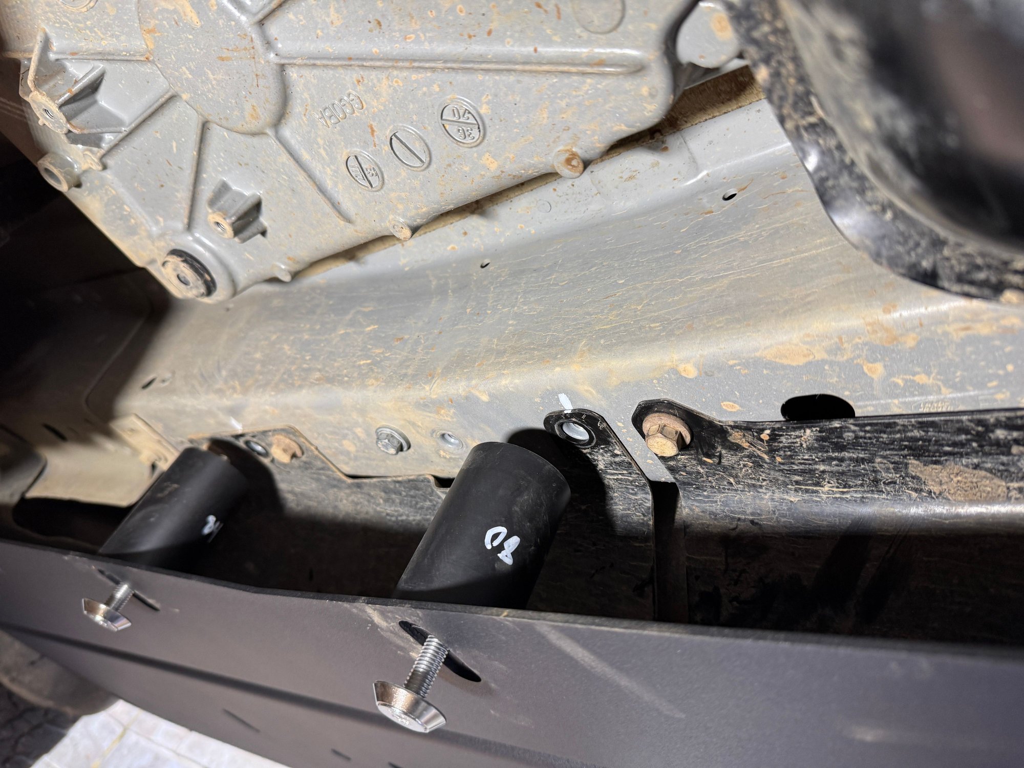 Labelled spacers.. good idea. Do this. You can see here where I did not remove the black guards it said to remove in the instructions. This is something I annotated in the red notes in the instructions, fine to note remove these btw on US models if you just remove the bolts (I marked them with a white dot on the frame of the car, you can see it above the spacers..) 