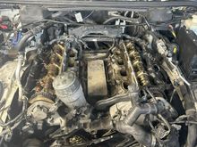 The beginning of the tear down. The previous owner bent the timing cover to look inside vs taking the crank pulley off