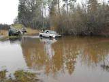 a dodge pick up stuck in the h2o. dont worry, there was a disco handy to affect a rescue