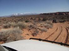march2011moab 063.  Wheeling Arches NP to Eye of the Whale.  La Sal Mountains in the distance.  Fun sandy trails along here.
