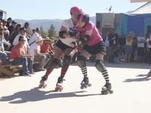 Don't mess with me on the rink! First bout at a bike rally.  I'm in the pink shirt.
