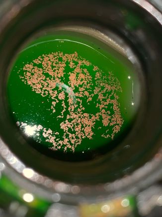 Coolant with metallic scum on top after sitting for a day. Coolant hasn’t been drained completely in at least 4.5 years.