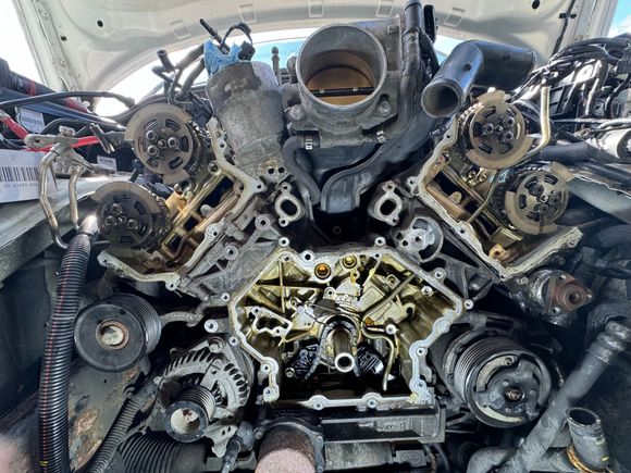 Photo of the front engine covers removed, guide, tensioners, chains removed. With exception of the oil pump and fuel sensor chain. 