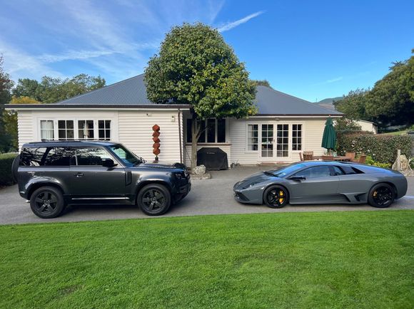 My V8. 20’ wheels and roof rails as I intend to occasionally off road it. Had it a few months now and love it! Great vehicle! 
The speed bump in front of me belongs to a friend. His V12 is faster than my V8 but I still prefer mine!