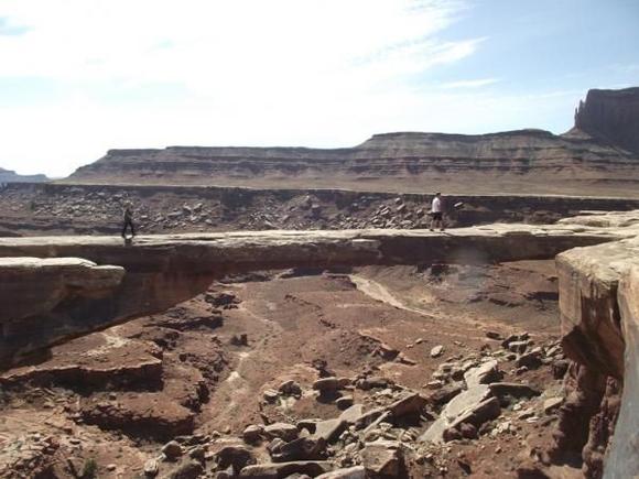 march2011moab 183.  Mussleman Arch along White Rim trail.  My son is walking across on the right.