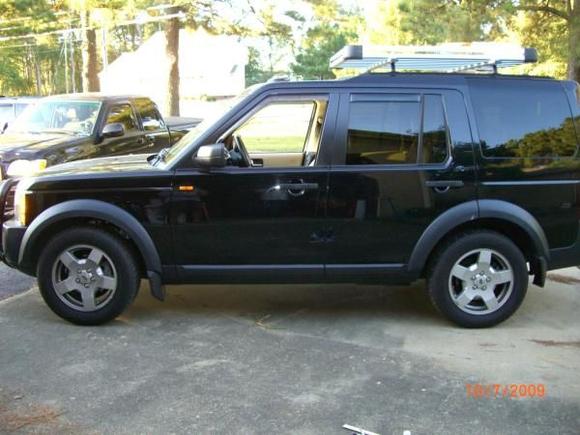 Driver' side before the installation of the OEM Rubbing Strip (side body protection molding).  Surco Urban Roof Rack, OEM Brush Guard, WeatherTech Vent Deflectors, 35% Tint all windows except rear, 20% rear tint.  Front windows are down in this photo.