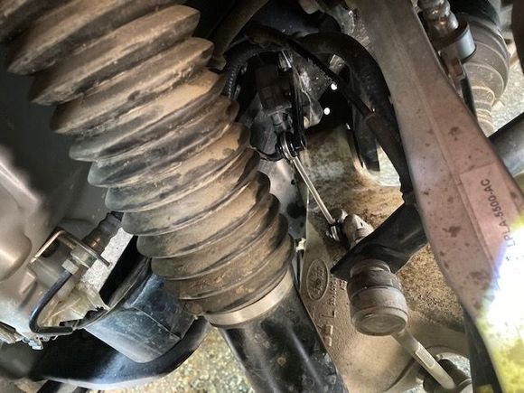 View looking in from above the rear tire with rod in place. 