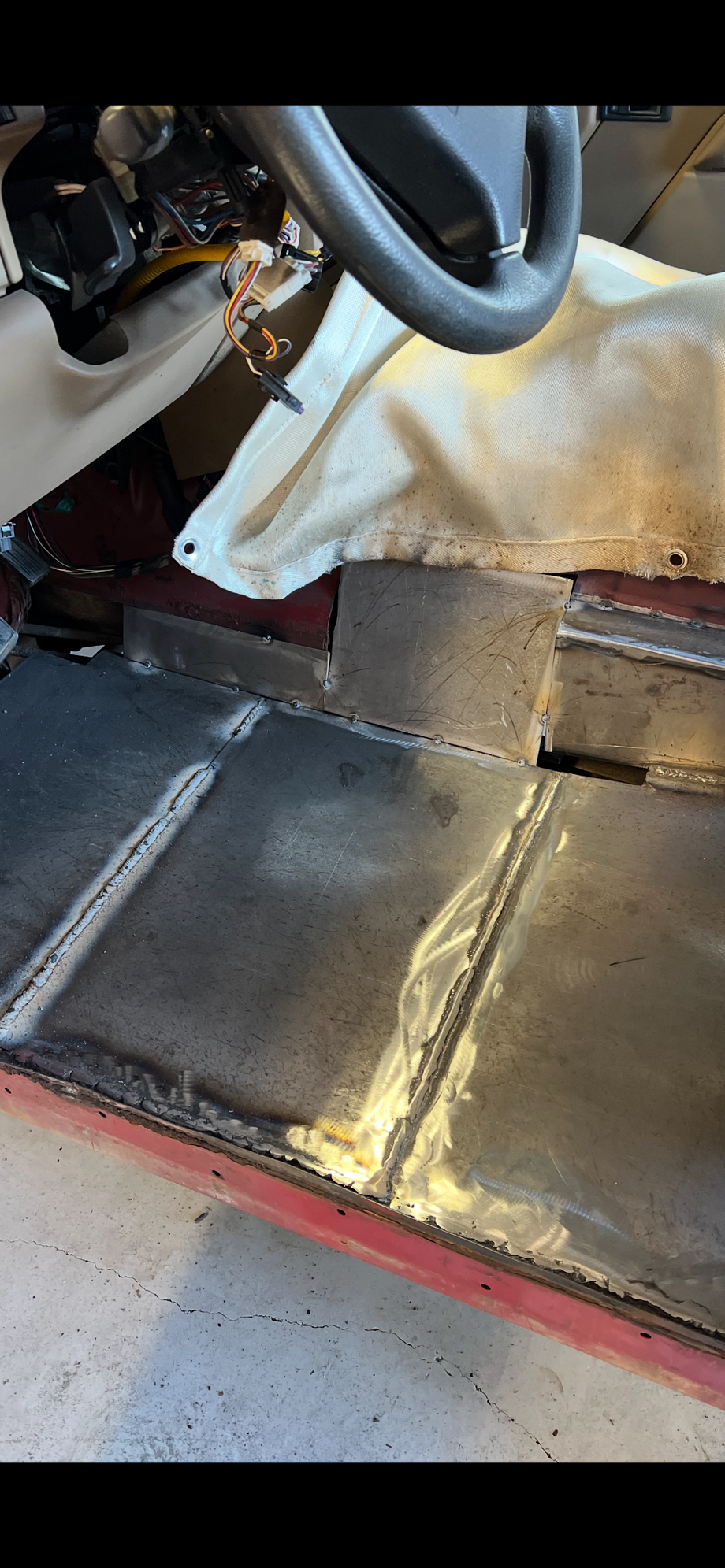 I am edging closer and closer to getting this done. The wierd box was my solution to avoiding whatever that circular sensor / plug was going into the side of the transmission. The box is out of the way of everything and the seats fit fine in there and it�ll be hidden so I�m not too worried with it. But it�s cold here, so progress is moving slow! Haha