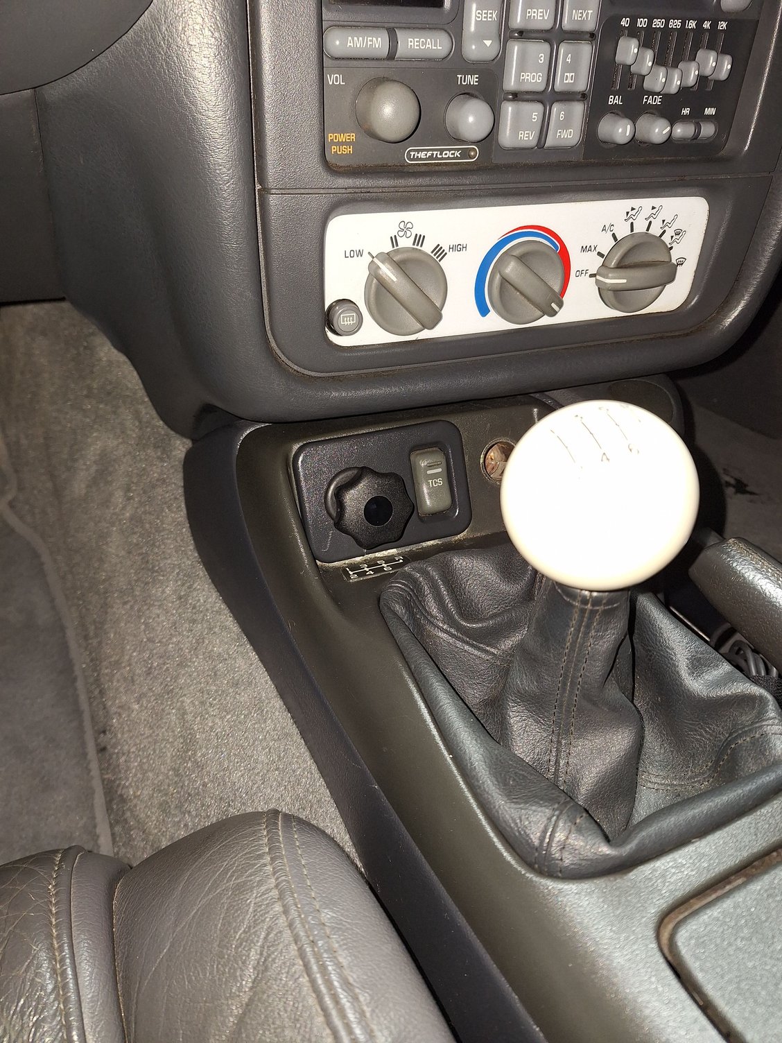 Clutch tamer valve installed, completely hidden except for the adjustment ****.