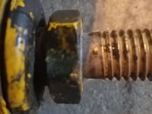 Do they go between this bolt head and the threads?