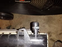 Port that was used for the Lt1 oil cooler. Found a plug at Napa. Later on this plug cracked and failed. I ended up going with 5/8 radiator hose with a brass plug clamped on the end.