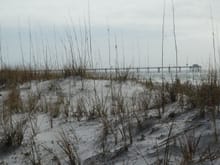 Sand dunes and Okaloosa Pier behind our motel
