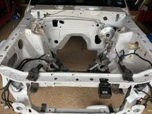 Parts going back in!  I need to sand and paint those two upper radiator support brackets.