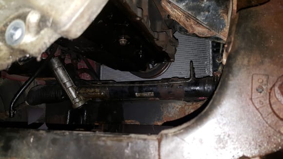 I had just a tad over 3 inches between the top of the rack and the base of the block that the oil pan mounts to. I had the 2x4 on the windage tray so it gave me a little more then the 1.5 inch lift of the 2x4 alone. 