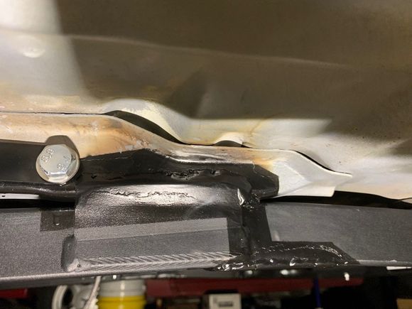 Middle, outside.  Again, you can see the reinforcing plate weld to the lower right of the MM welded on tab.
