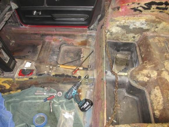 Notice the seam along the rear floor below the brace where two body halves had been joined. This is no virgin car.