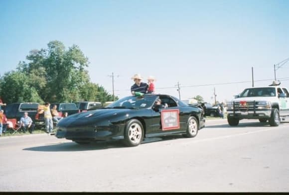 In a parade with my son riding on top.