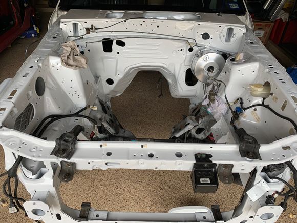 Parts going back in!  I need to sand and paint those two upper radiator support brackets.