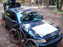 Despite being lowered, my Max still handles rough forest roads pretty well. Here it is on a camping trip in the wilderness a few weeks ago. The bike is worth about 3x the car (sans mods).
