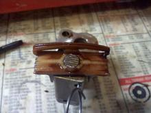 Old tensioner completely worn through plastic.  Thank you Nissan </sarcasm>