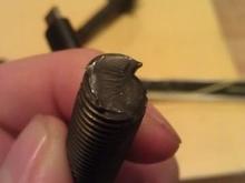 You can actually see where the planes slipped in the metal's crystal structure.