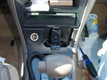Put my GPS where the Ash tray usually is, and placed my phone charger, as well as the charger for the GPS under my center console to clear any wires out of the way.