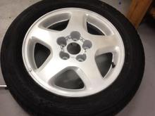 Stock wheel. 5 Coats of matte white plastidip, 3 coats of Pearlizer.