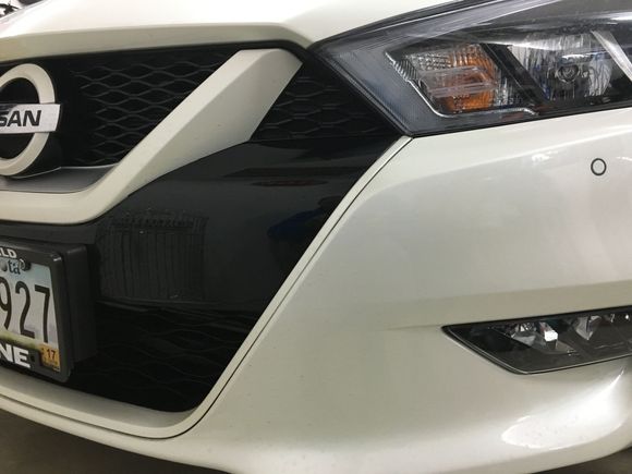 2016 SR pearl white vinyl wrap on front end chrome.