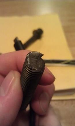 You can actually see where the planes slipped in the metal's crystal structure.