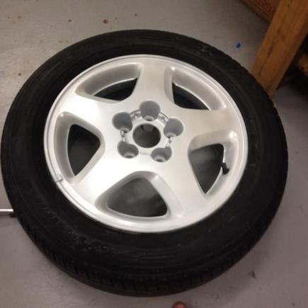 Stock wheel. 5 Coats of matte white plastidip, 3 coats of Pearlizer.