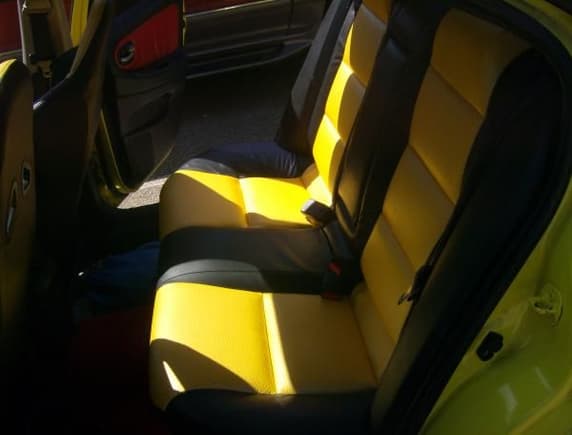 Custom rear upholstery in yellow vinyl