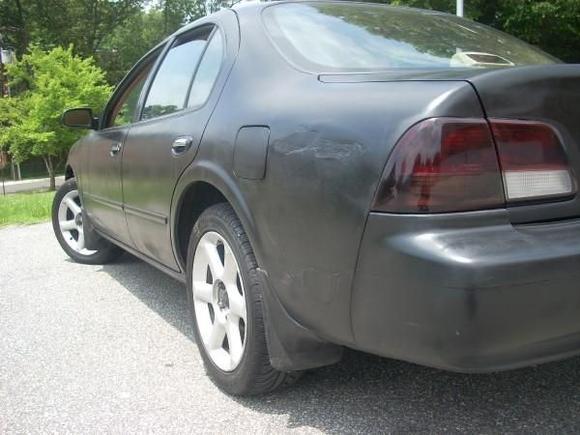 damaged left quarter panel... got hit by a piece of shit honda