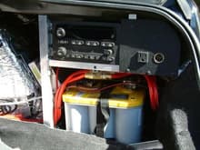 Electricals in the right side panel. Not shown is the new RCA jacks in the outlet panel. XM and Sirius tuners are in the background. The 110V power invertor is where the factory amp used to be. There is a 110V outlet in the front console, also, for a laptop computer.