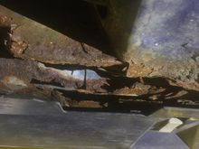 Really very little you can do short of cutting it out and replacing the metal. Places wanted over $2000 to do this, and I passed. 