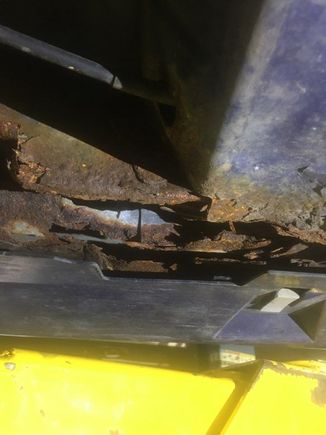 Really very little you can do short of cutting it out and replacing the metal. Places wanted over $2000 to do this, and I passed. 