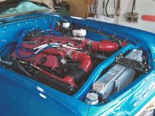 Yea! That huge red red blob is a "96 Gen 2 Viper! ECU was popped for 500 hp and 500 fpt. It fit after the old huge old heater fan, radiator and housing went. You can see the outline in the bolt pattern on the firewall. Radiator was moved to  the front side of the core support and water pump inlet was cut and turned.