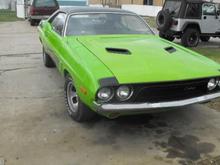 I know the color doesnt exactly match but I painted the hood just as a test to see if I could even do automotive paint. So I'm fixing to start stripping her down and redoing the whole car. Also you should go read the story on all the sh!t I went through painting the hood lol its under general discussion under the thread Crazy Sh!t.