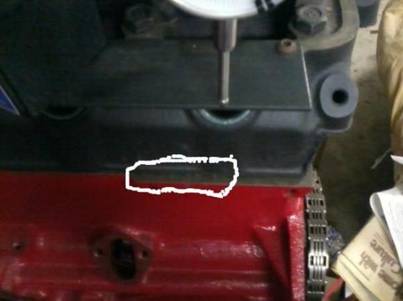 The circled area is where the block will be stamped. As long as nobody has decked the engine. If the deck has been cut substantially, the stamping may be gone. 

The stamp is the only way you'll be able to tell the difference between a 198 and a 225. Otherwise, all differences are internal to the engine. (Rod length, and crank stroke.)