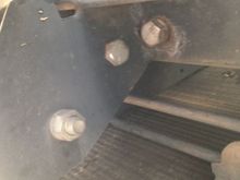 Underside.  Bolted to the frame supports.