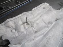 Showing slit open insulating pad to allow attachment wires to pass through