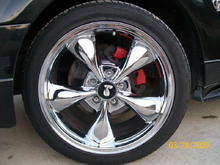 Front rim with red caliper.