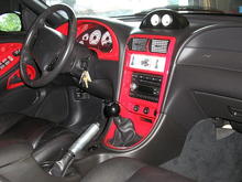 interior with red painted accents, pro 5.0 shifter. changing all gauges to black face brushed bezels.