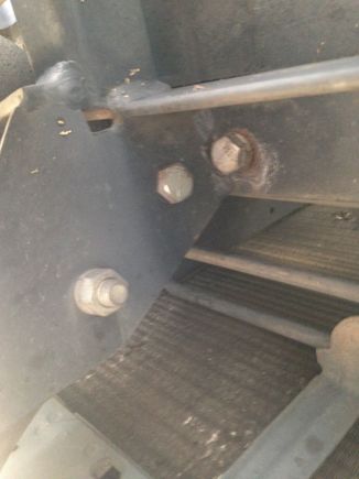 Underside.  Bolted to the frame supports.