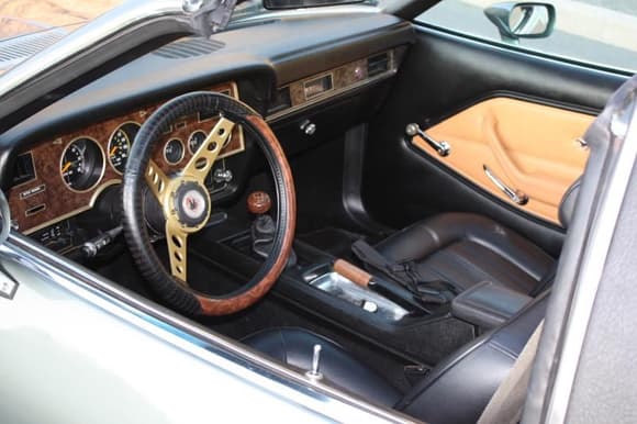 Interior emulates pony interior styling and includes a dash from an earlier model with gold accents